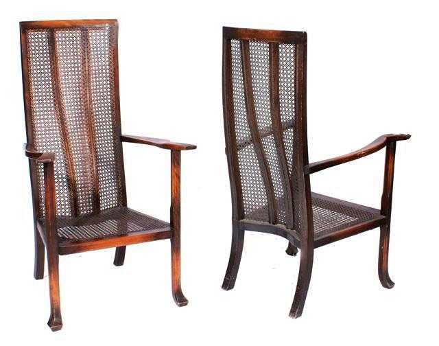 Appraisal: A PAIR OF 'S BEECH FRAMED ELBOW CHAIRS caned seats