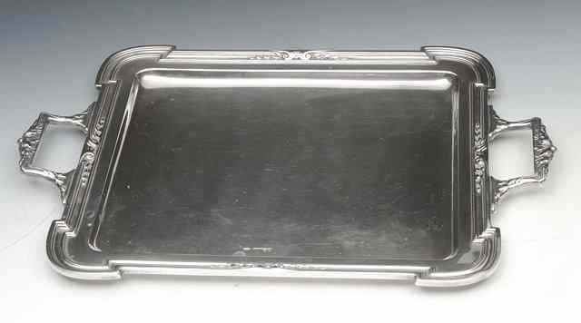 Appraisal: A CONTINENTAL SILVER RECTANGULAR TRAY with moulded edge and shaped