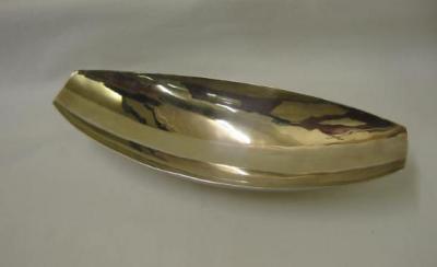 Appraisal: AN ARTS AND CRAFTS STYLE DISH of slender oval form