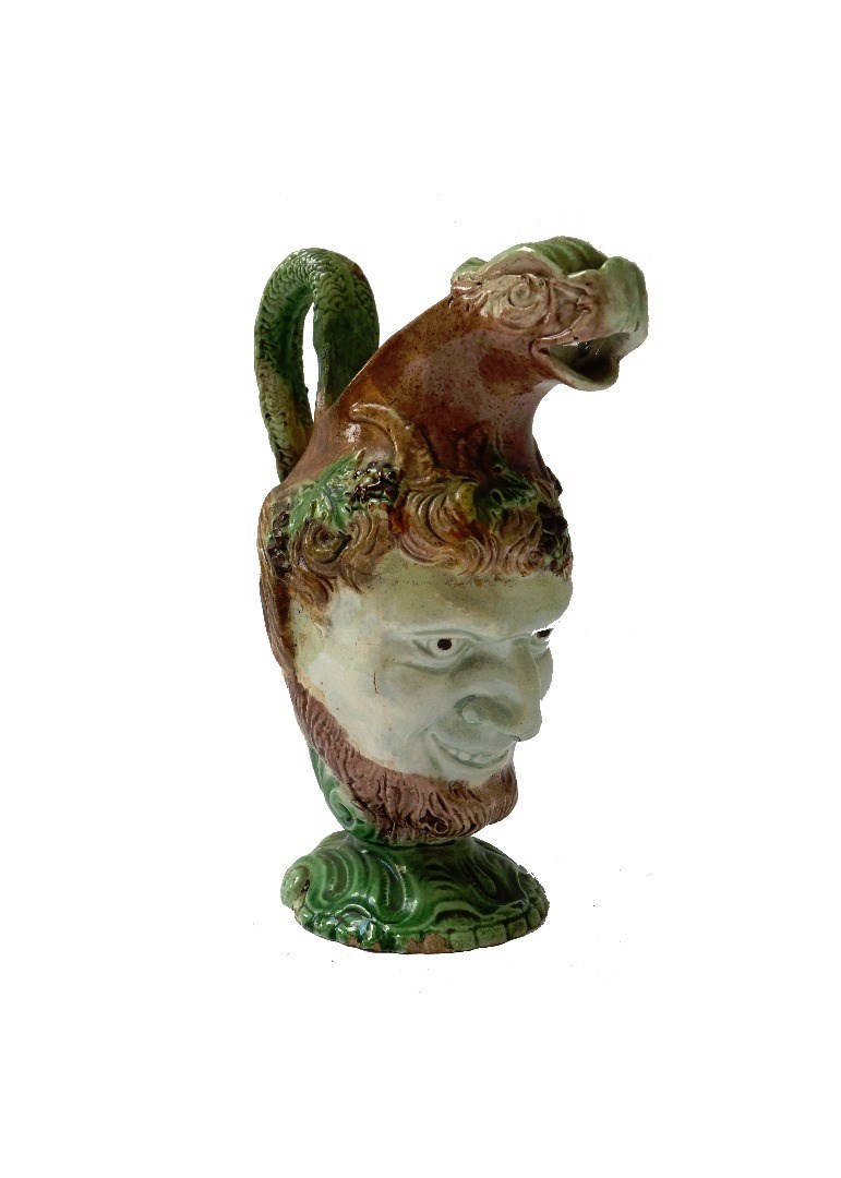 Appraisal: A Staffordshire pearlware satyr mask jug circa with dolphin moulded