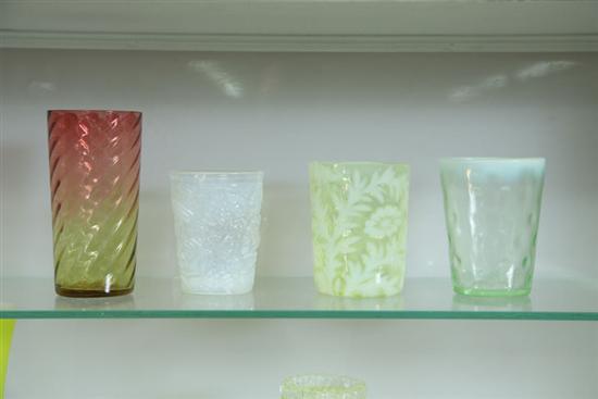 Appraisal: FOUR ART GLASS TUMBLERS Amberina swirl Vaseline with opalescent Daisy