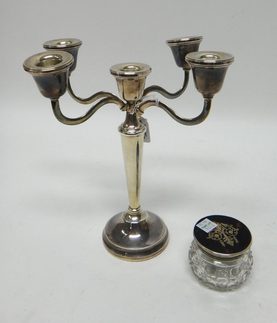 Appraisal: A silver five light table candelabra on a circular base