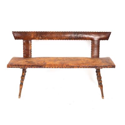 Appraisal: A mid th Century alpine walnut settle the nailed leather