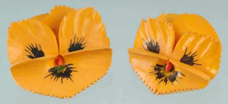 Appraisal: Lot of Bakelite Carved Pansy Pins Description With painted decoration