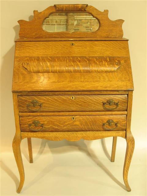 Appraisal: VICTORIAN OAK LADIES SLANT FRONT DESK the shaped crest with