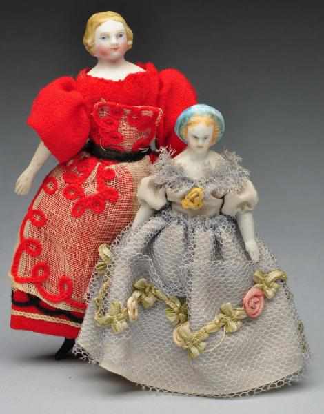 Appraisal: Pair of Doll House Dolls Description German parian bisque shoulder