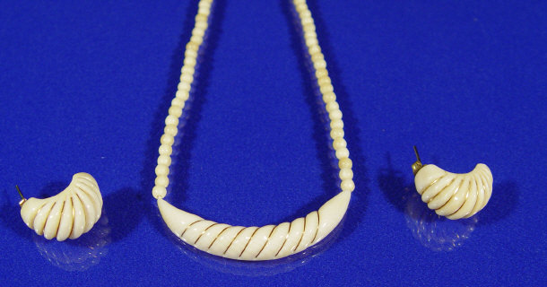 Appraisal: Ivory gold inlaid necklace and a matching pair of earrings