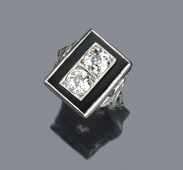 Appraisal: A diamond and black onyx ring set with two old-European