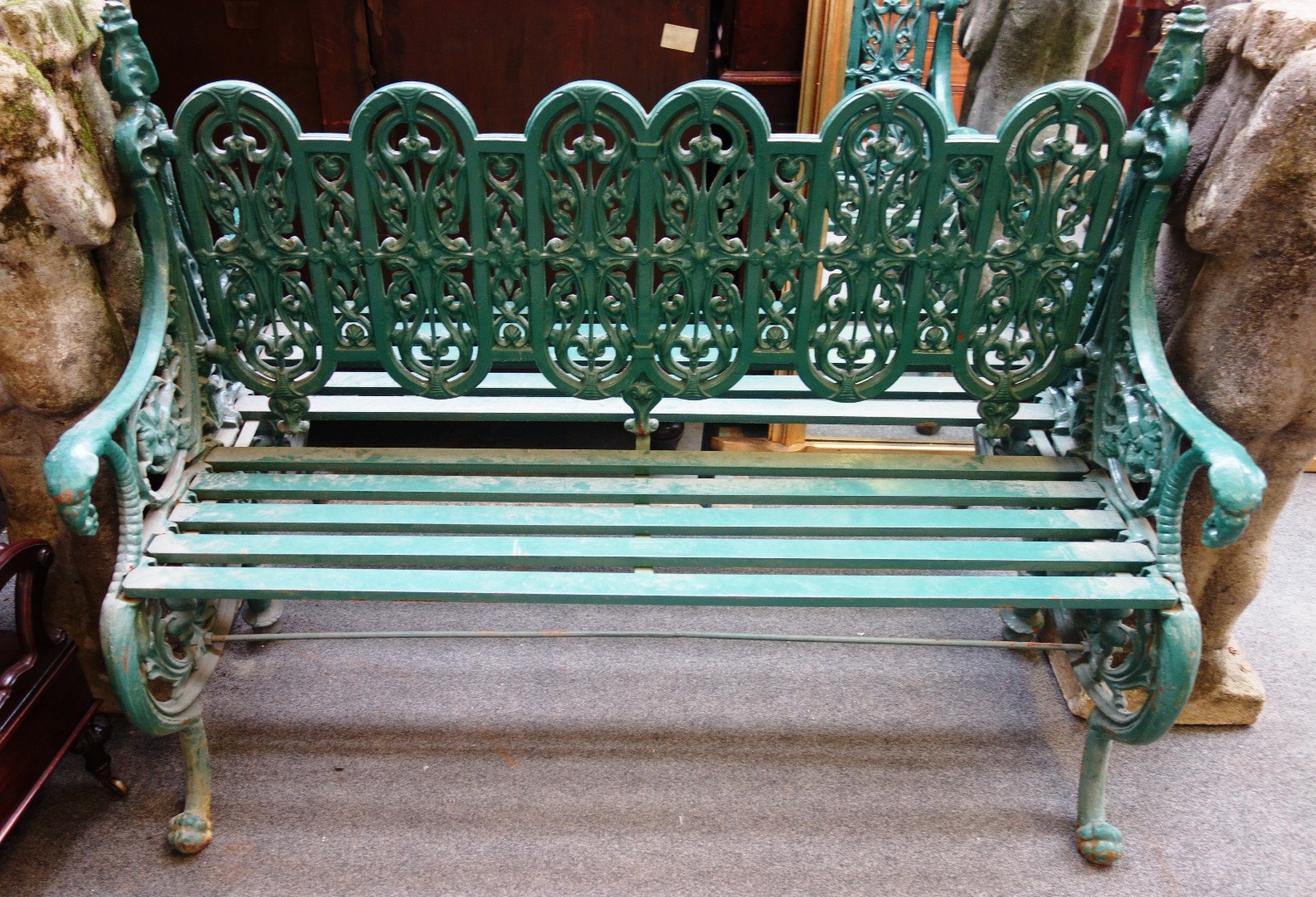 Appraisal: A Coalbrookdale style green painted double sided cast iron garden