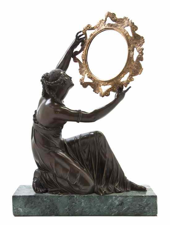 Appraisal: A French Gilt and Patinated Bronze Figure cast as a