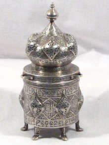 Appraisal: A fine Islamic silver incense burner with Arabic script listing