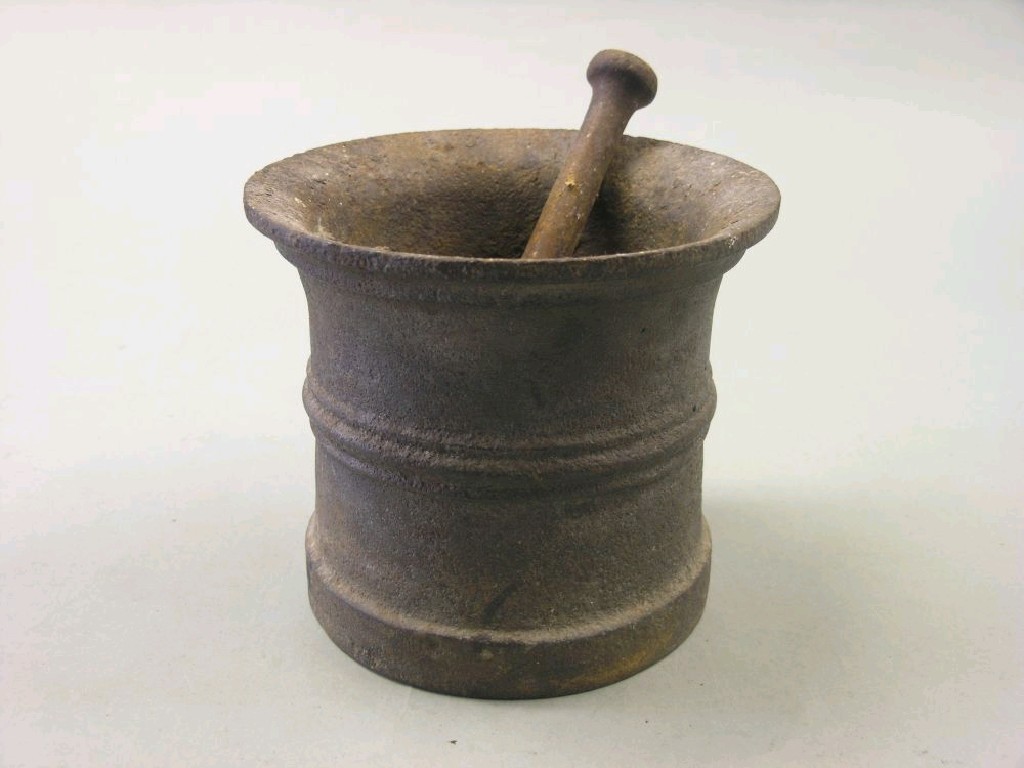 Appraisal: An early iron mortar in probably th century complete with