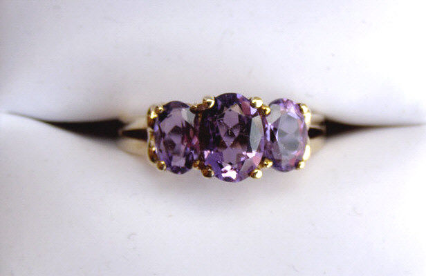 Appraisal: K yellow gold lady's three stone oval amethyst ring retails