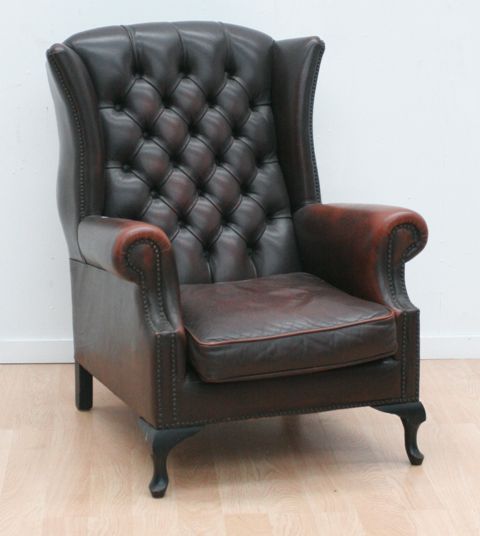 Appraisal: A Chesterfield style wingback armchair