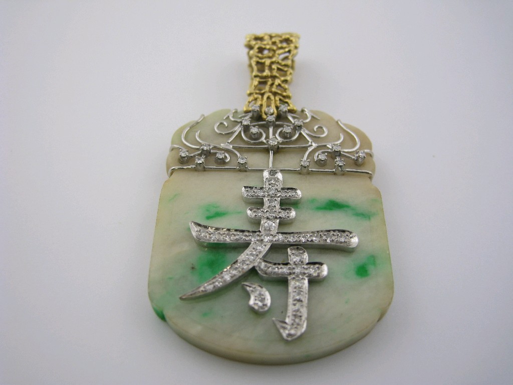 Appraisal: A Jade and Diamond Pendant the carved jade pav -set