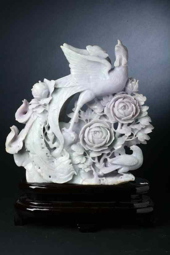 Appraisal: CHINESE LAVENDER AND CELADON JADEITE CARVING OF PHOENIX Carved with