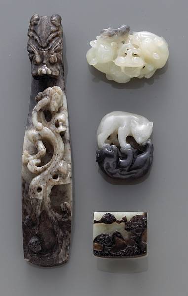 Appraisal: A group of four black and white jade carvings th