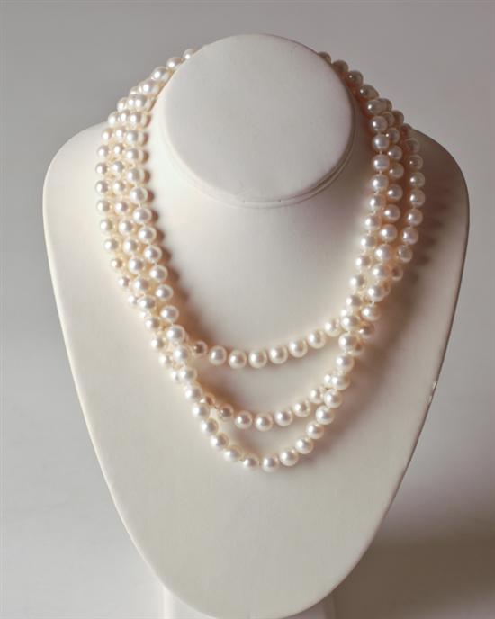 Appraisal: A Triple Strand Pearl Necklace with mm cultured pearls and