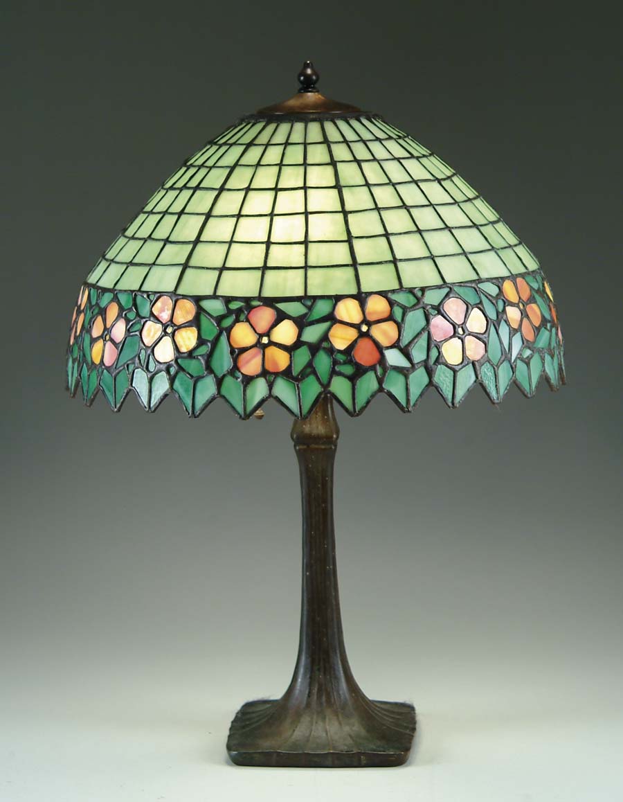 Appraisal: LEADED GLASS TABLE LAMP Leaded glass shade has green geometric