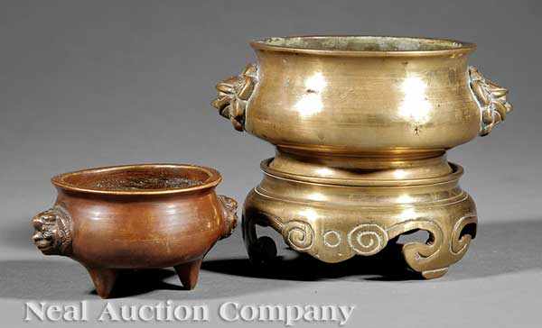 Appraisal: Two Chinese Bombe-Form Bronze Censers with Mask Handles Qing Dynasty