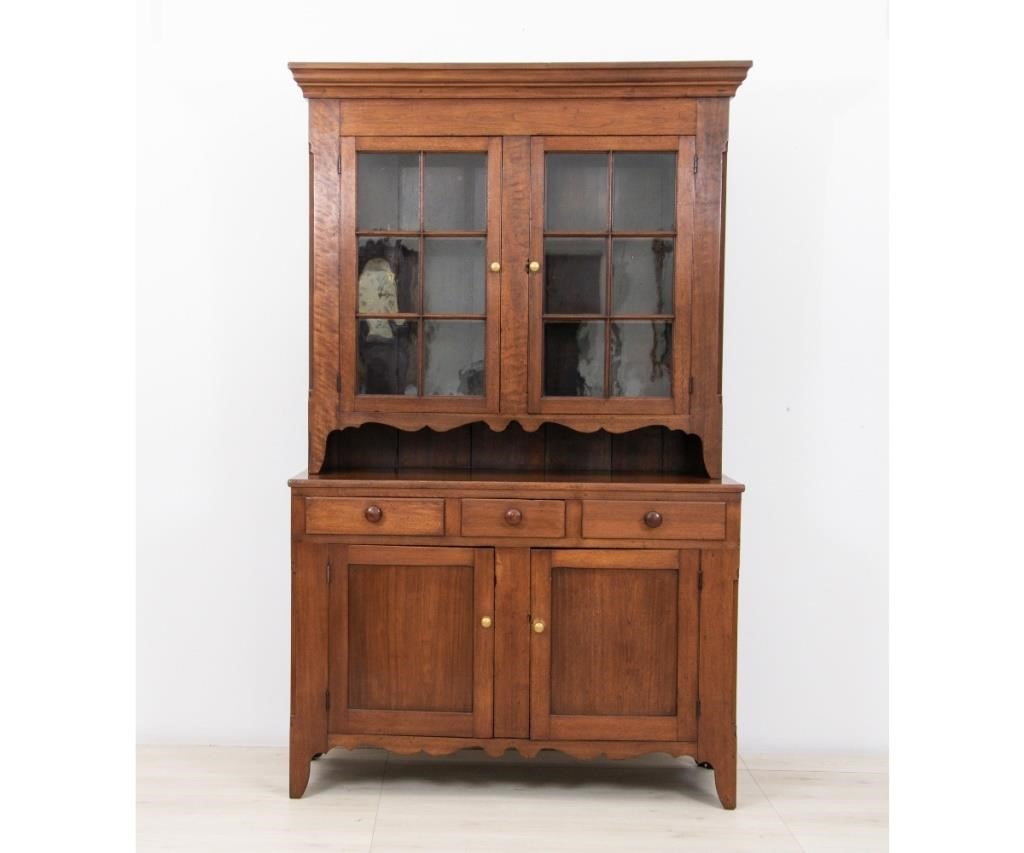 Appraisal: Pennsylvania two-piece walnut Dutch cupboard circa with molded cornice above