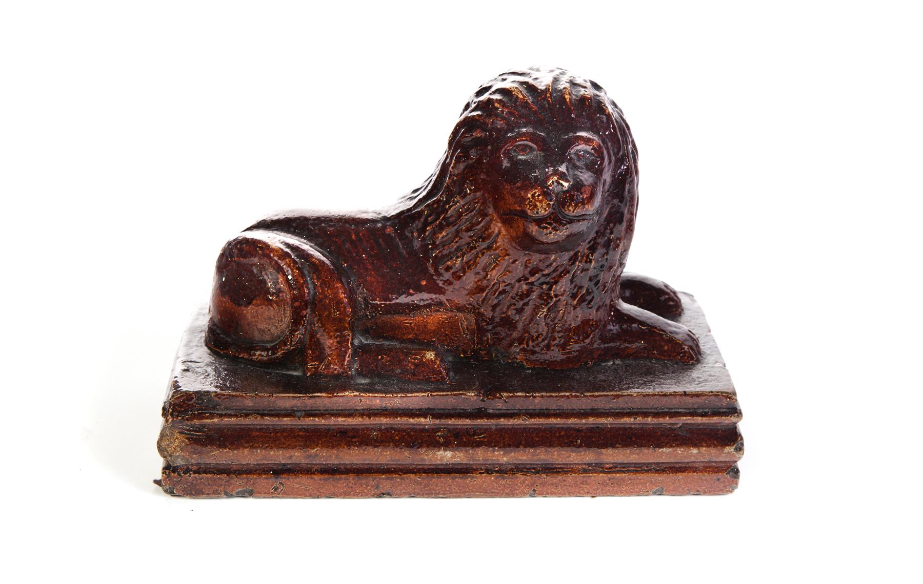 Appraisal: AMERICAN SEWERTILE LION First half- th century Molded reclining lion