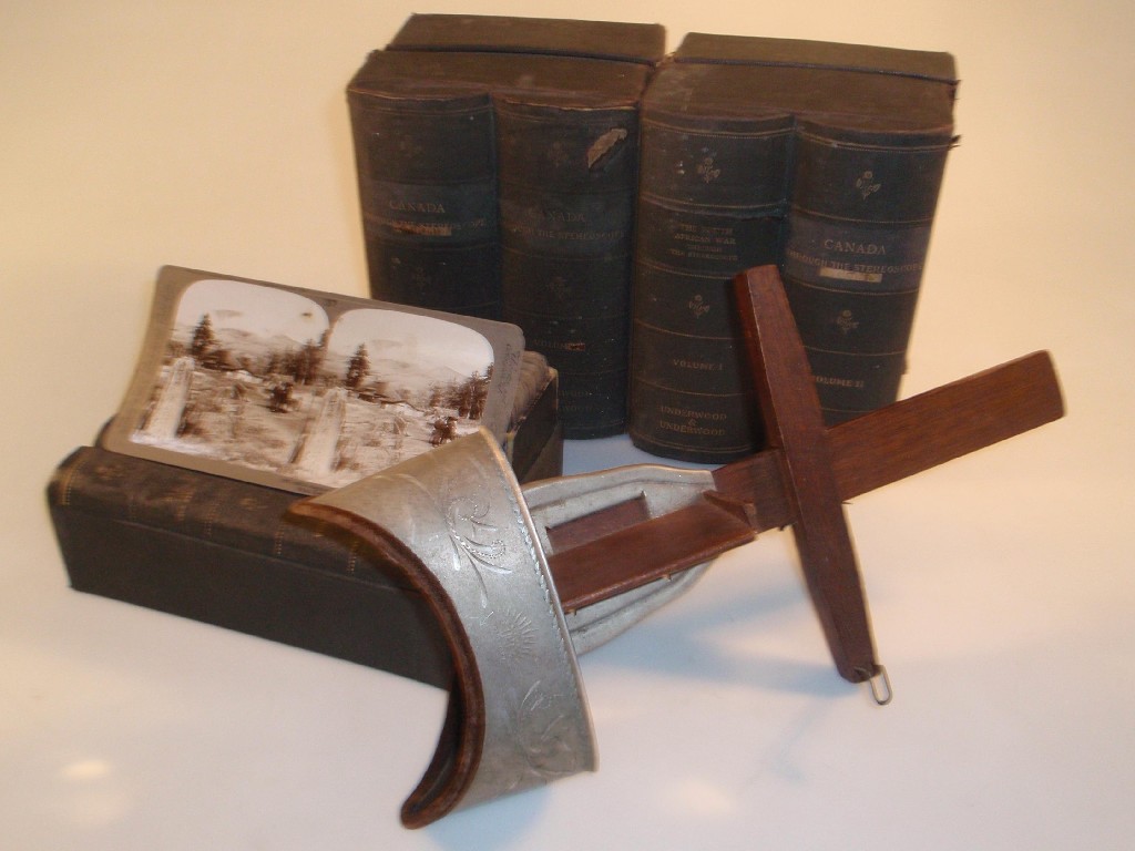 Appraisal: An Underwood Underwood stereoscopic viewer together with cased sets of