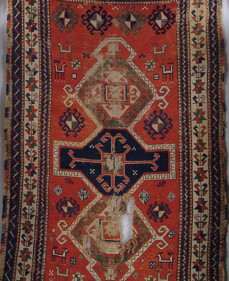 Appraisal: THREE CAUCASIAN ORIENTAL RUGS All antique with holes and as