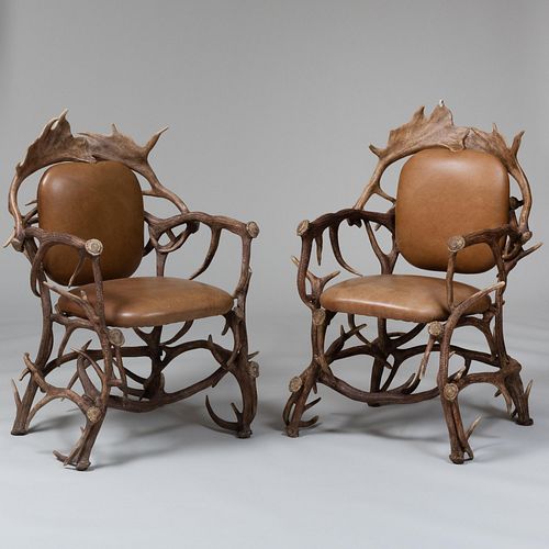 Appraisal: PAIR OF FAUX ANTLER AND LEATHER ARMCHAIRS x x in