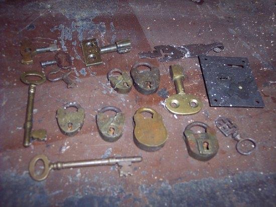 Appraisal: A collection of small brass padlocks brass keys etc