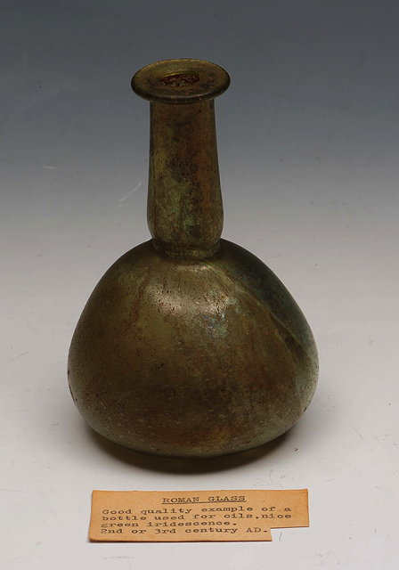 Appraisal: A ROMAN GLASS OIL BOTTLE with green iridescence nd or