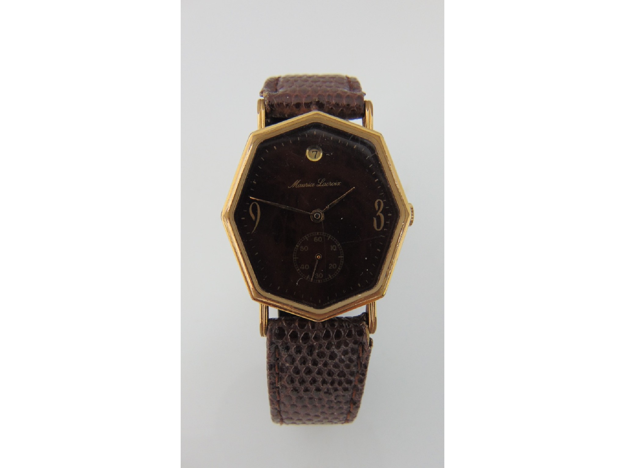 Appraisal: A vintage wristwatch Maurice Lacroix the octagonal-shaped mottled brown dial