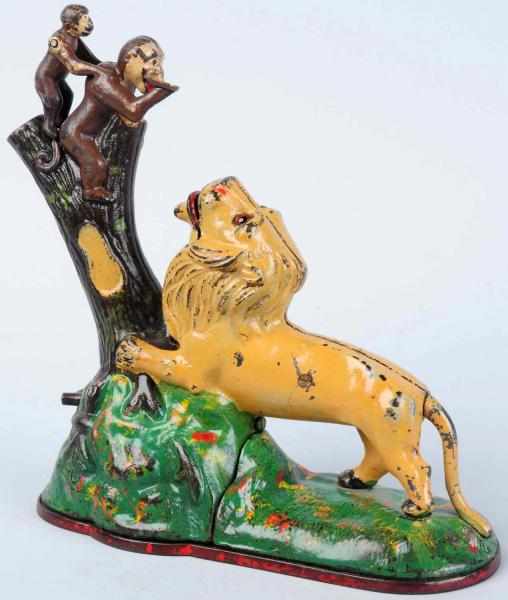 Appraisal: Cast Iron Lion Two Monkeys Mechanical Bank Manufactured by Kyser