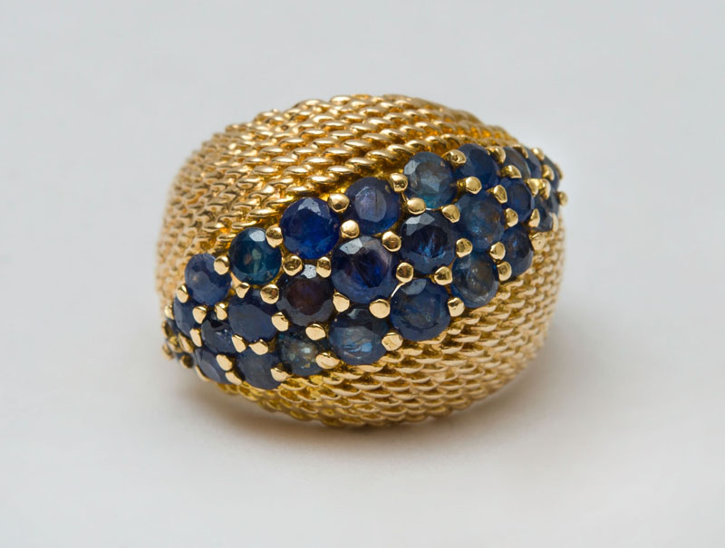 Appraisal: K GOLD AND SAPPHIRE DOMED RING Size approx grams Collection