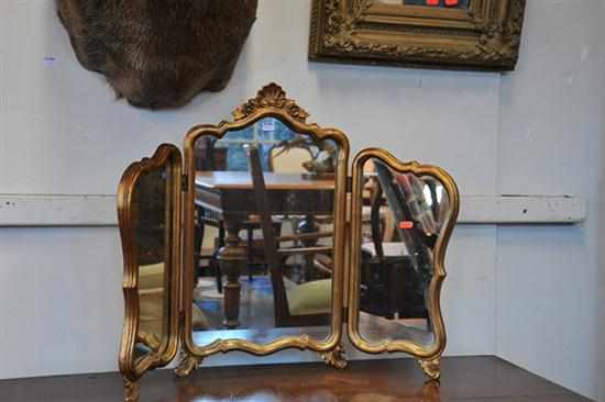 Appraisal: A THREE PANEL GILDED MIRROR