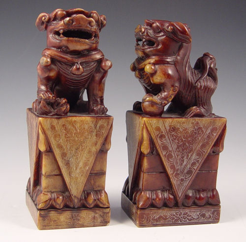 Appraisal: CHINESE CARVED SOAPSTONE FOO LION FIGURAL BOOKENDS '' x ''