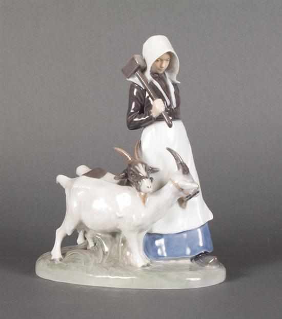 Appraisal: Royal Copenhagen porcelain goat herder with goats modeled as Dutch