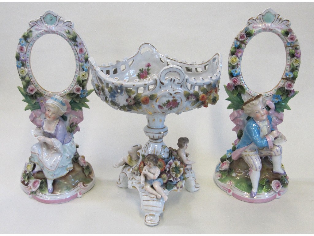 Appraisal: Pair of continental photograph holders and a Naples style centrepiece