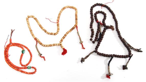 Appraisal: THREE NECKLACES Tibet L and cm Wood coral turquoise bone