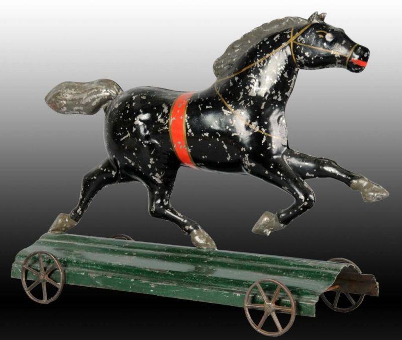 Appraisal: Early American Tin Horse Toy on Platform Description Iron wheels