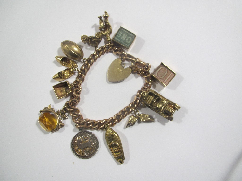 Appraisal: Nine carat gold charm bracelet with various ct gold charms