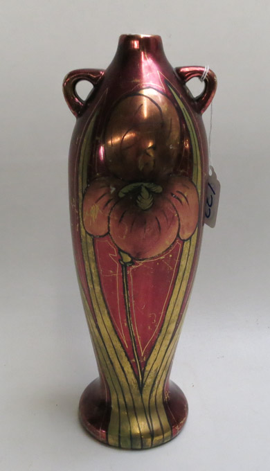 Appraisal: A SWASTIKA KERAMOS TALL HANDLED VASE with stylized iris design