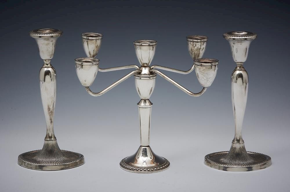 Appraisal: Grouping of three sterling silver candlesticks Grouping of three sterling