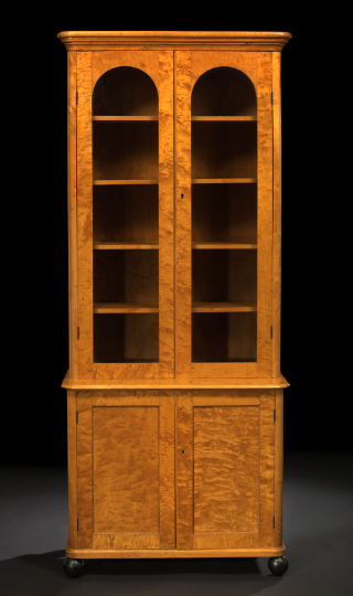 Appraisal: Biedermeier-Style Satinwood Bookcase the rounded and molded rectangular cornice above