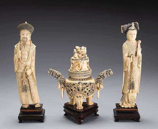 Appraisal: Three ivory carvings th Century Including a pair of emperor