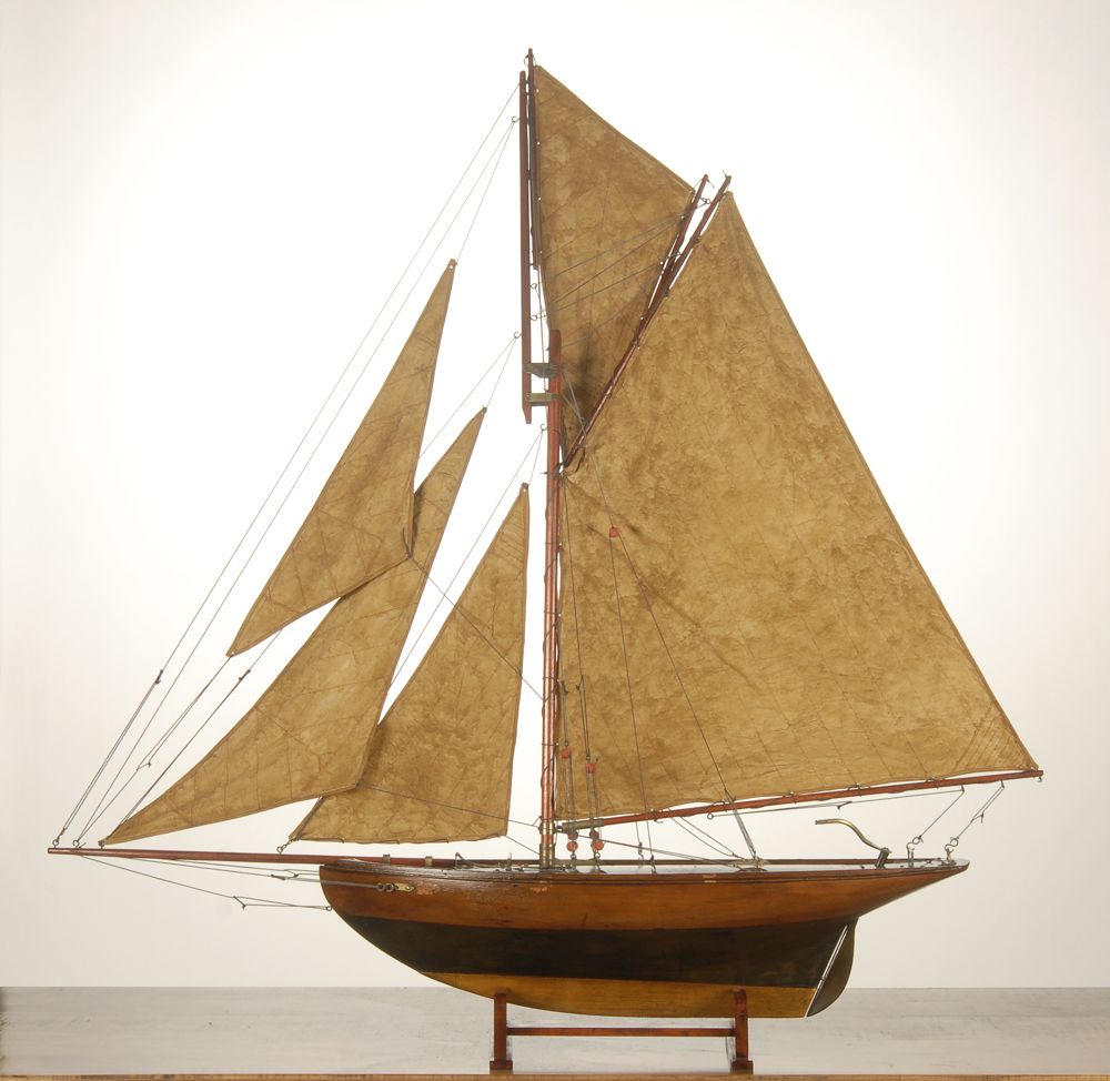 Appraisal: GAFF-RIGGED POND BOAT With a full suit of sails Varnished