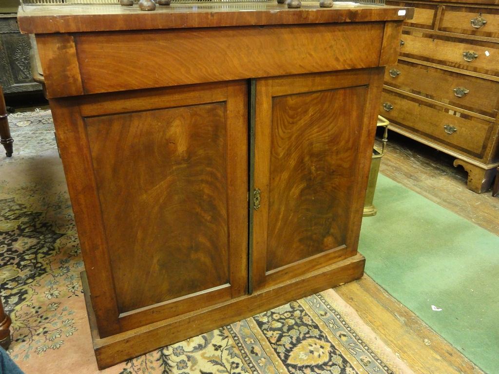 Appraisal: A th century mahogany chiffonier with raised pierced gallery over