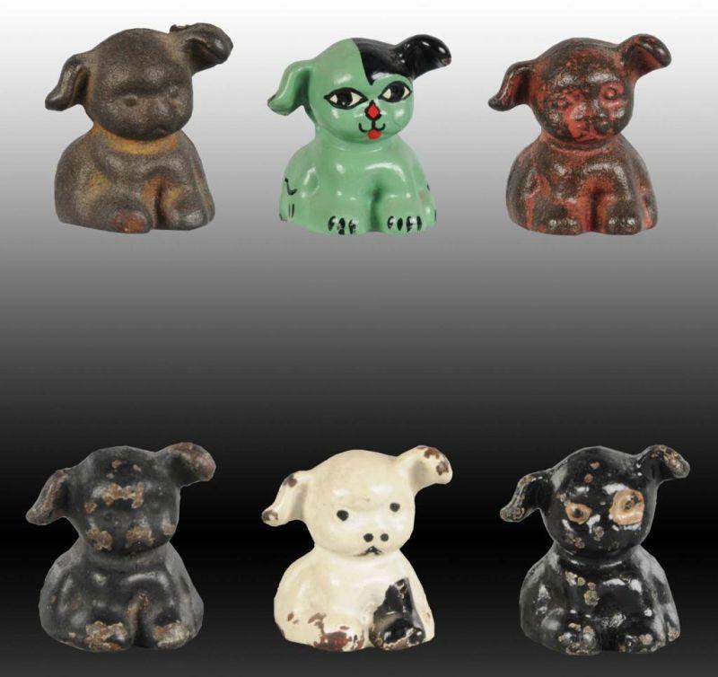 Appraisal: Lot of Puppo Dog Cast Iron Paperweight Description Assorted paint