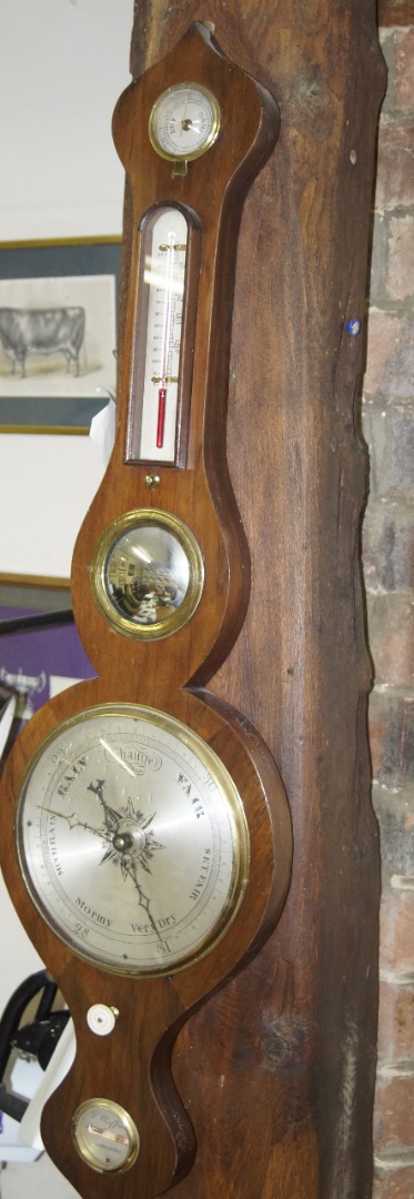 Appraisal: An early thC painted rosewood wheel barometer with swan neck