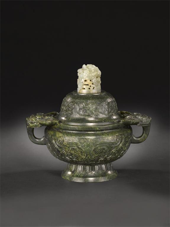 Appraisal: A large Chinese archaistic spinach-green jade bowl